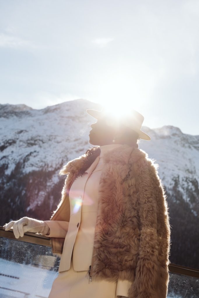 Cinematic backlit winter portrait in the Swiss Alps